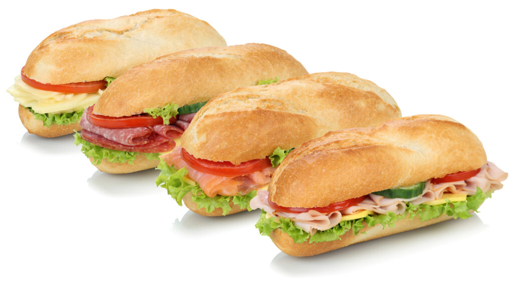 Four deli sandwiches in a row