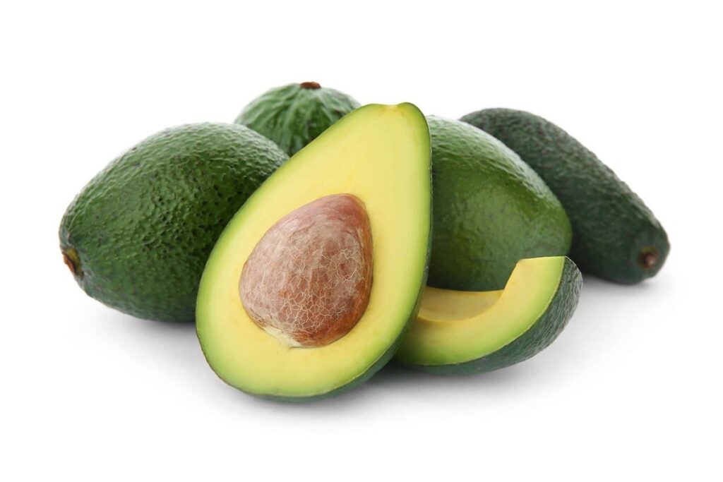 Whole and sliced avocados