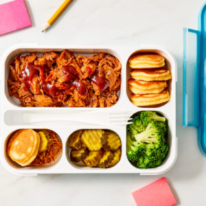 Corn cakes in lunchbox with sides