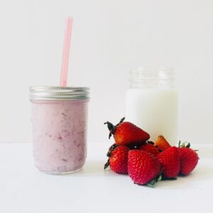 Homemade strawberry milk in glass jar