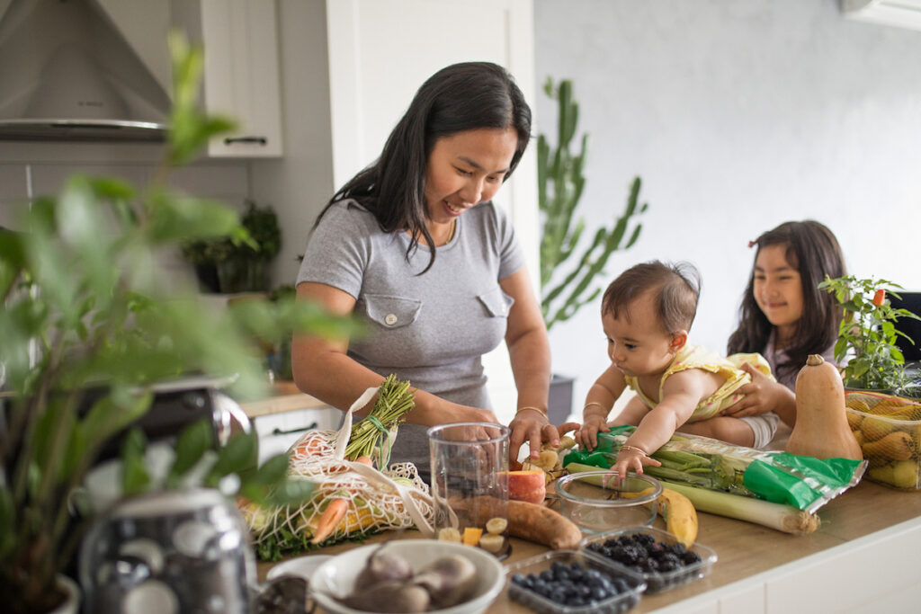 Mother preparing healthy foods for baby