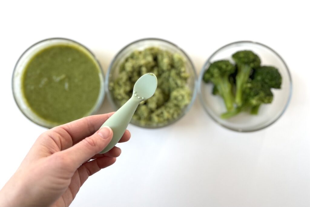 Tiny smear of baby food on spoon to be used for flavor training