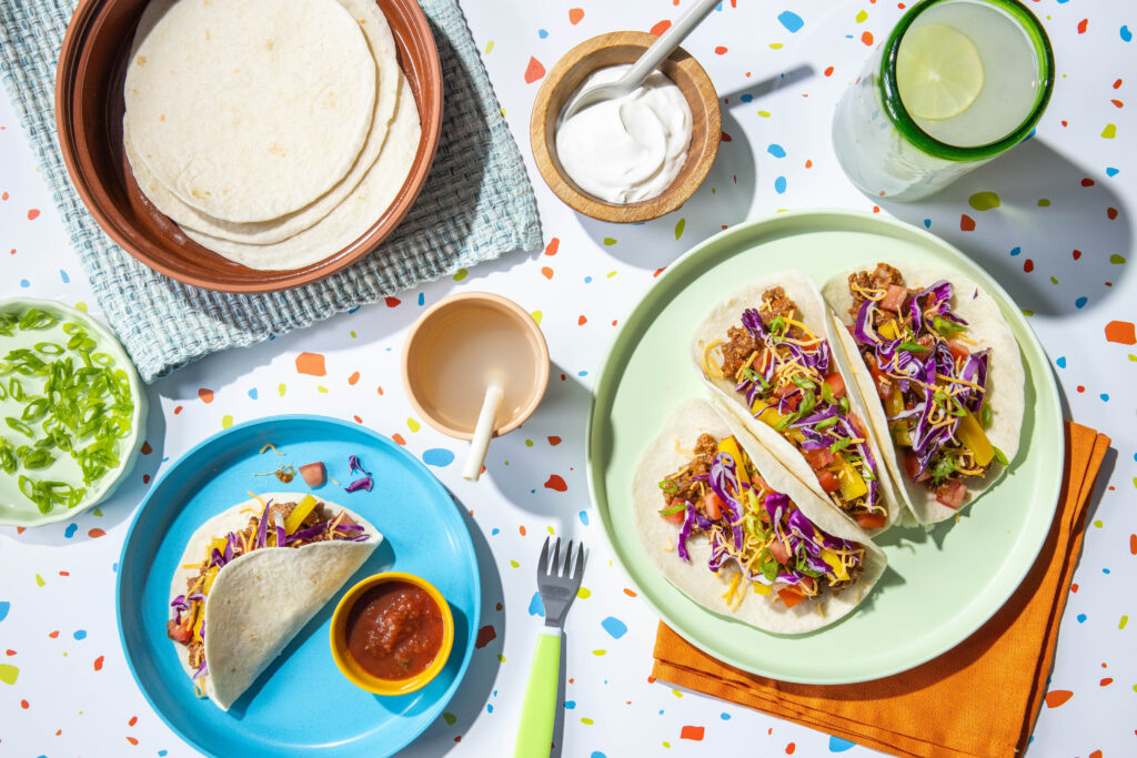 Build Your Own Rainbow Tacos with salsa and cheese