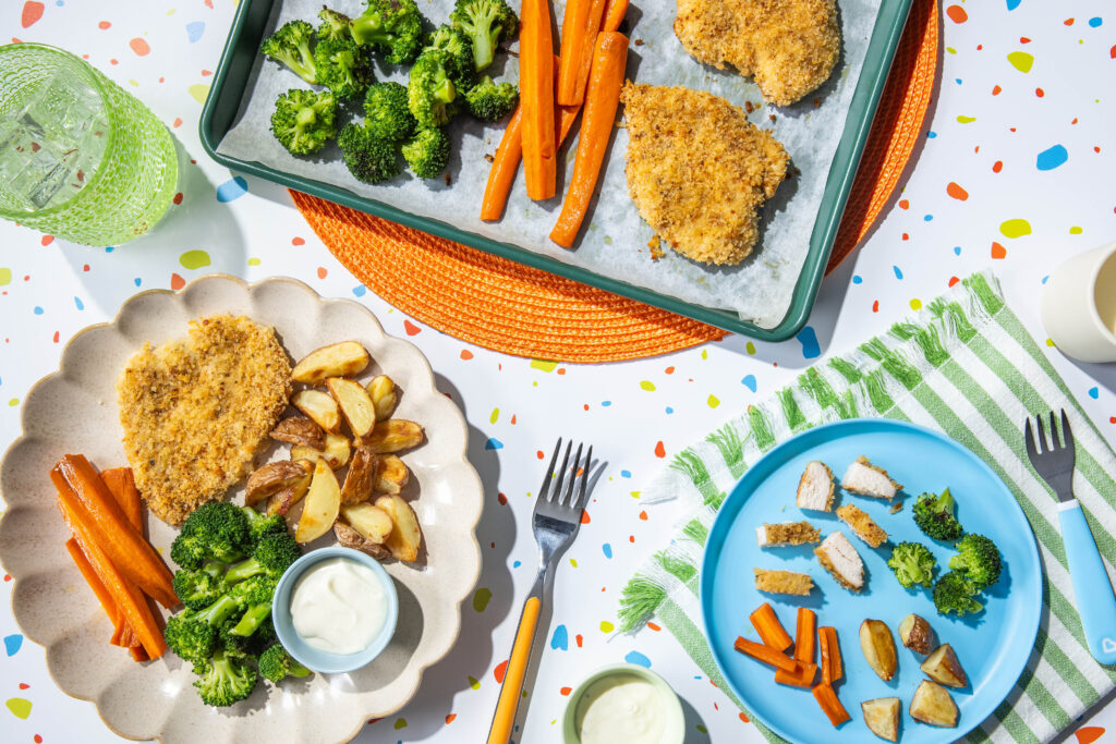 Parmesan-Crusted Chicken Cutlet with roasted potatoes, broccoli, and carrots
